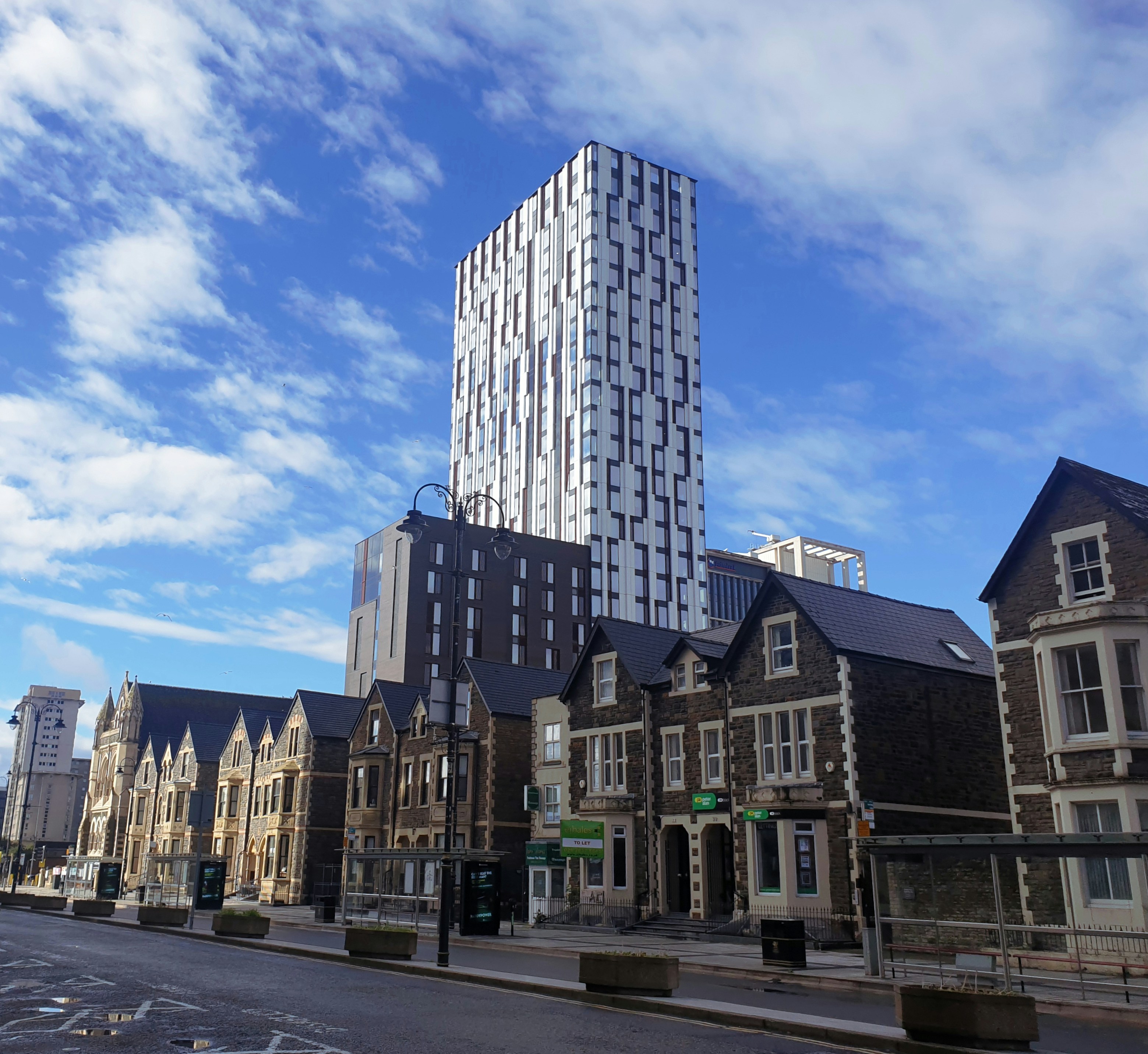 brown and white concrete building under blue sky during daytime