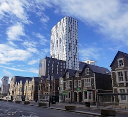 brown and white concrete building under blue sky during daytime