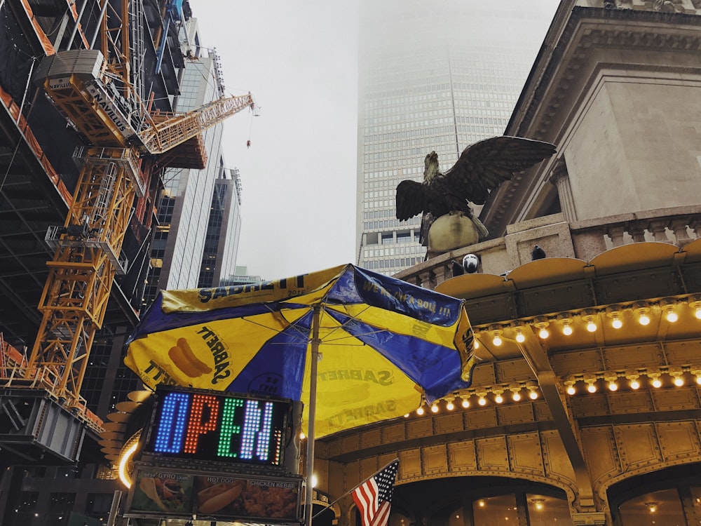 yellow and blue flag on top of building