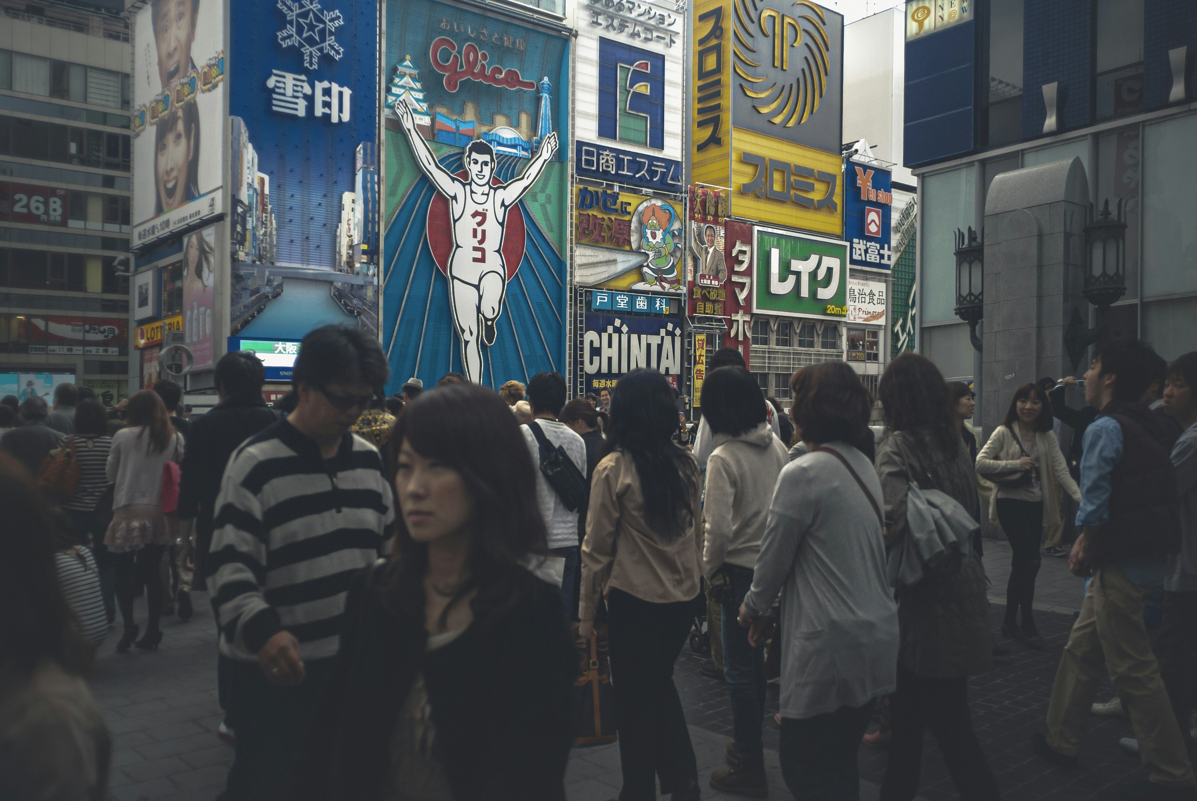 people walking on street during nighttime
