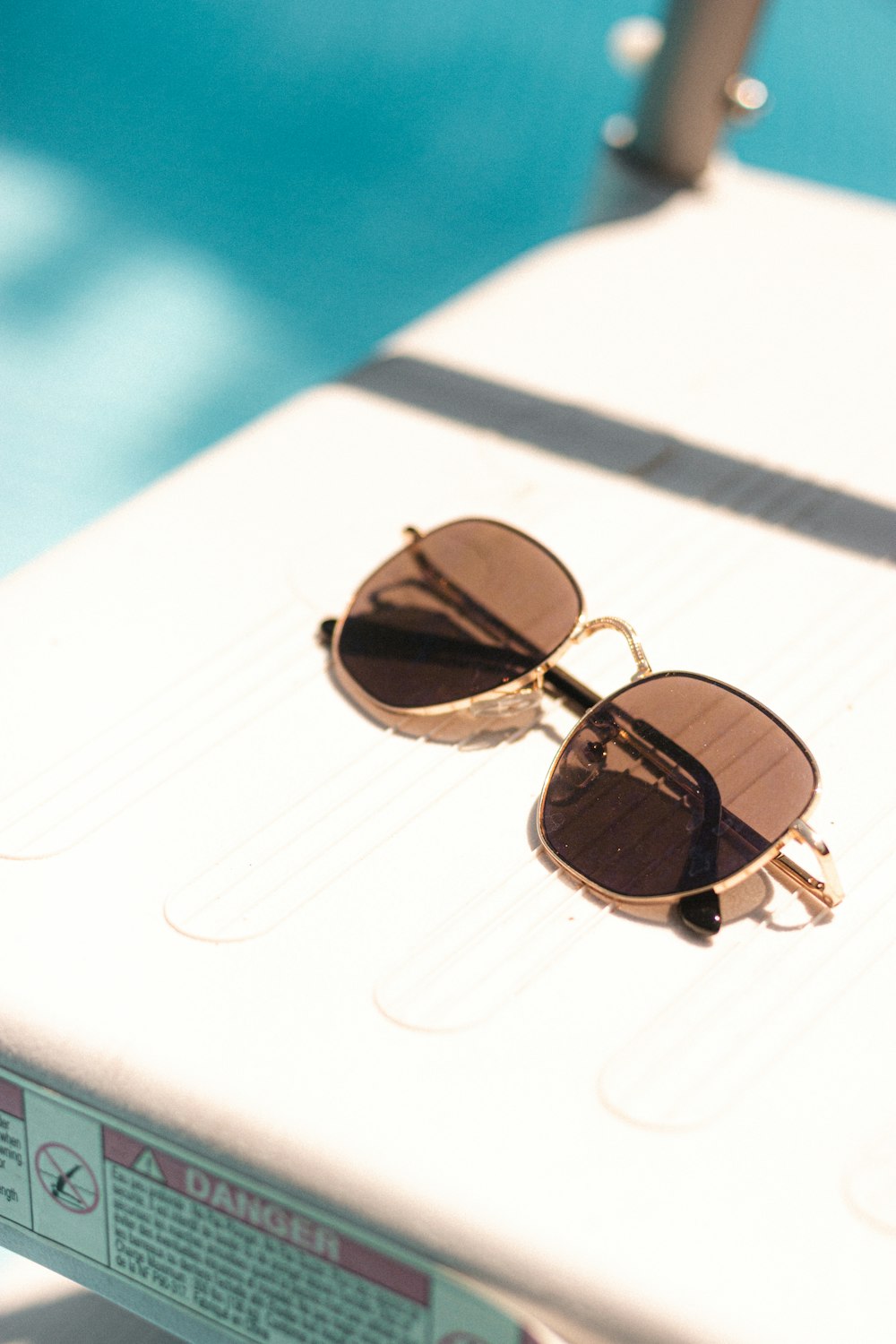 gold framed aviator style sunglasses