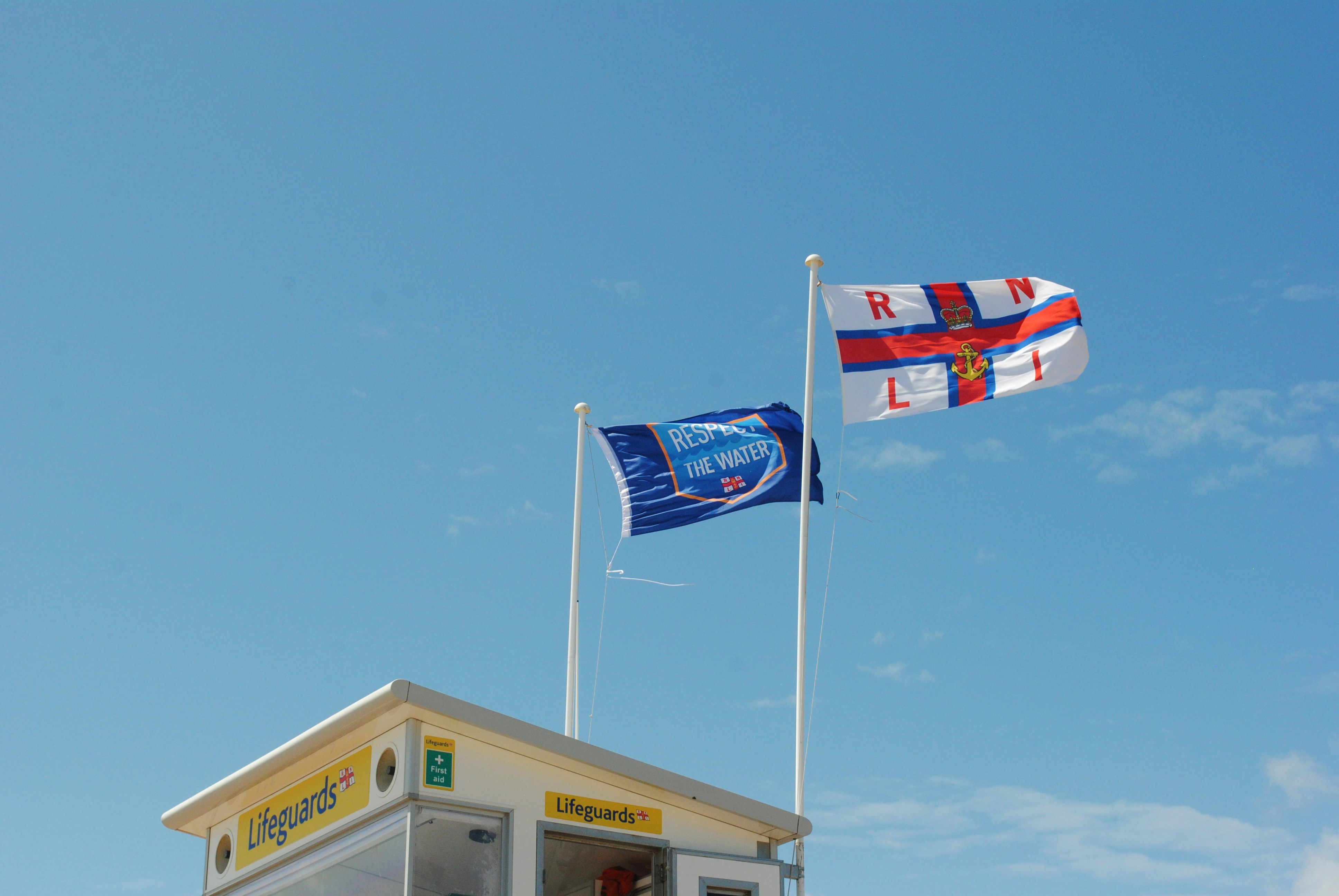 blue white and red flag on pole during daytime