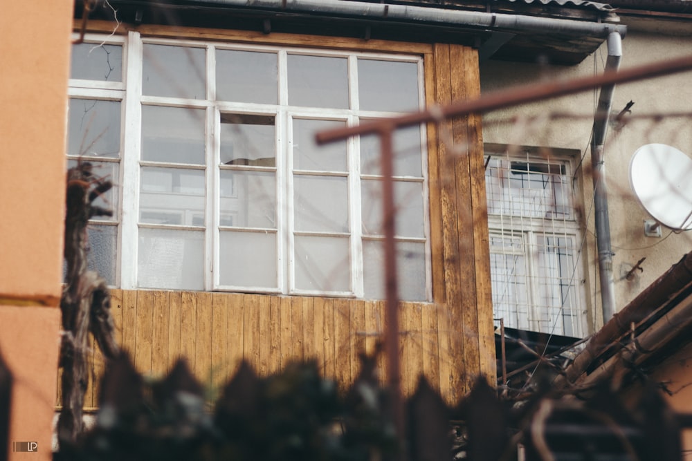 brown wooden framed glass window