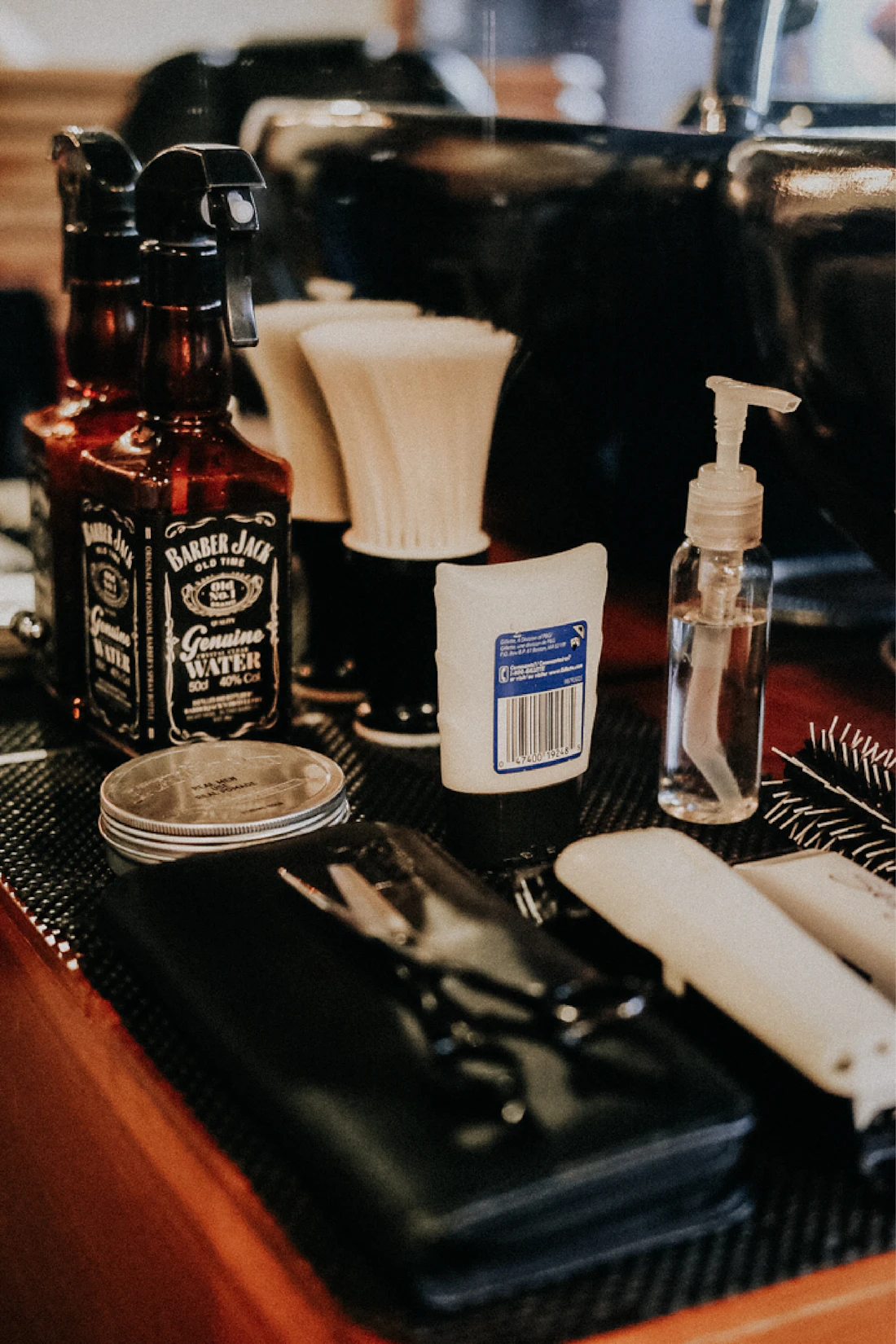 Working barber station with clippers, oils and Barbicide