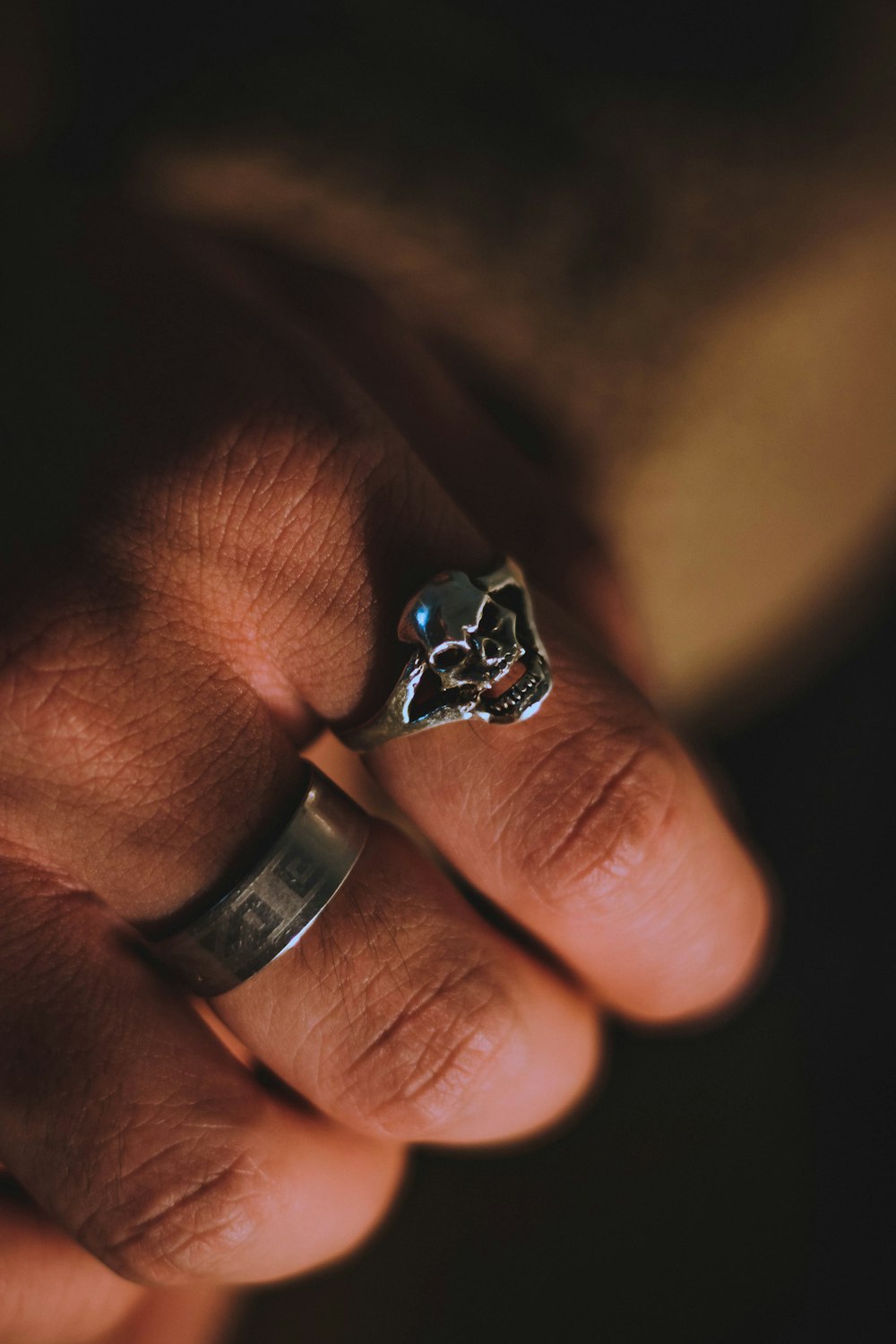 silver and black skull ring