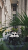 Elegant dining set placed in a lush garden setting.