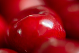 A close-up of a red apple with a soft glow.