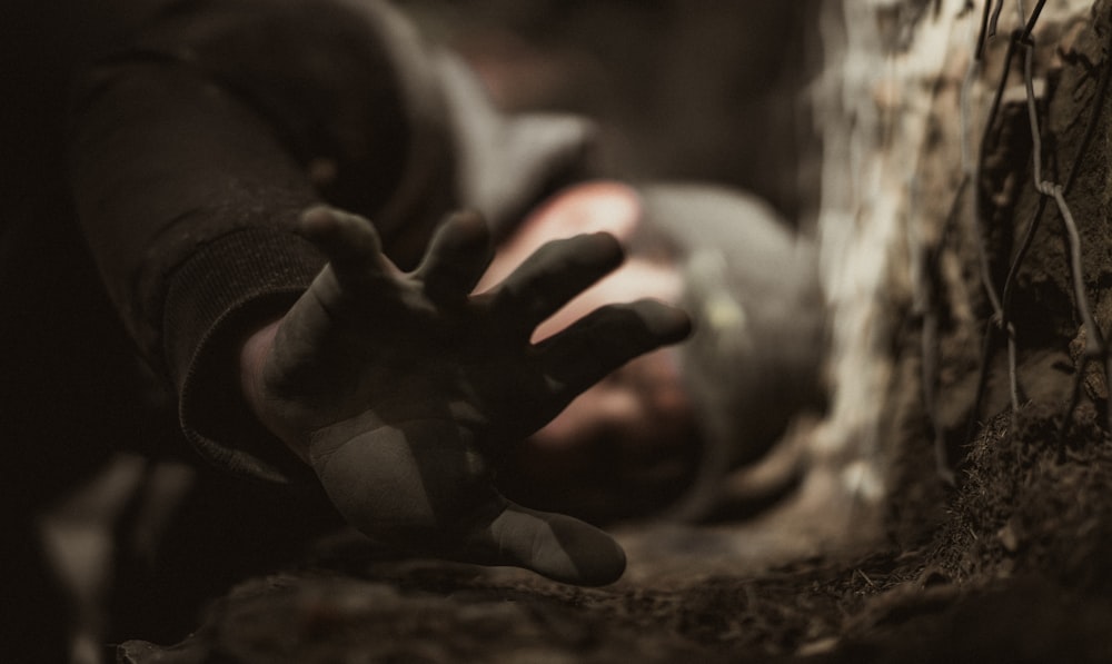 grayscale photo of persons hand