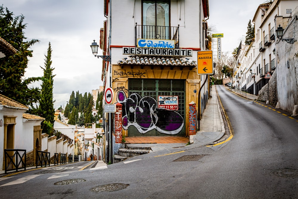 yellow and white concrete building beside road during daytime