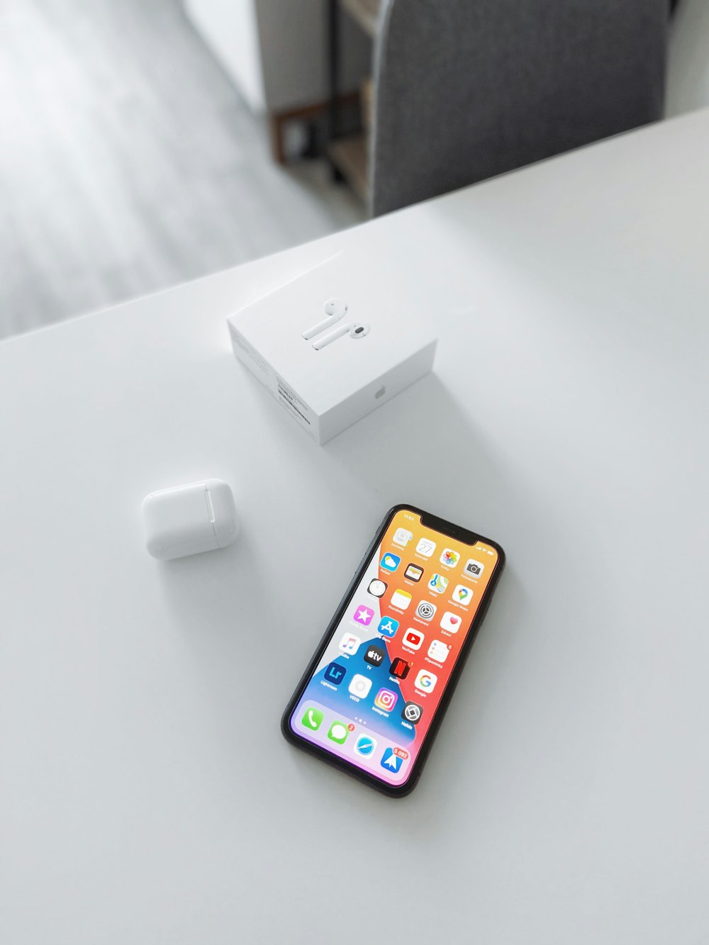 white apple charger beside white apple charger
