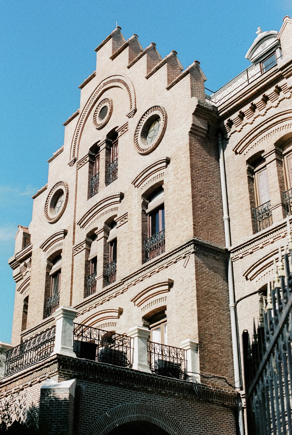 brown concrete building under blue sky during daytime