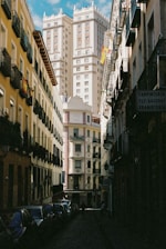 people walking on street between high rise buildings during daytime