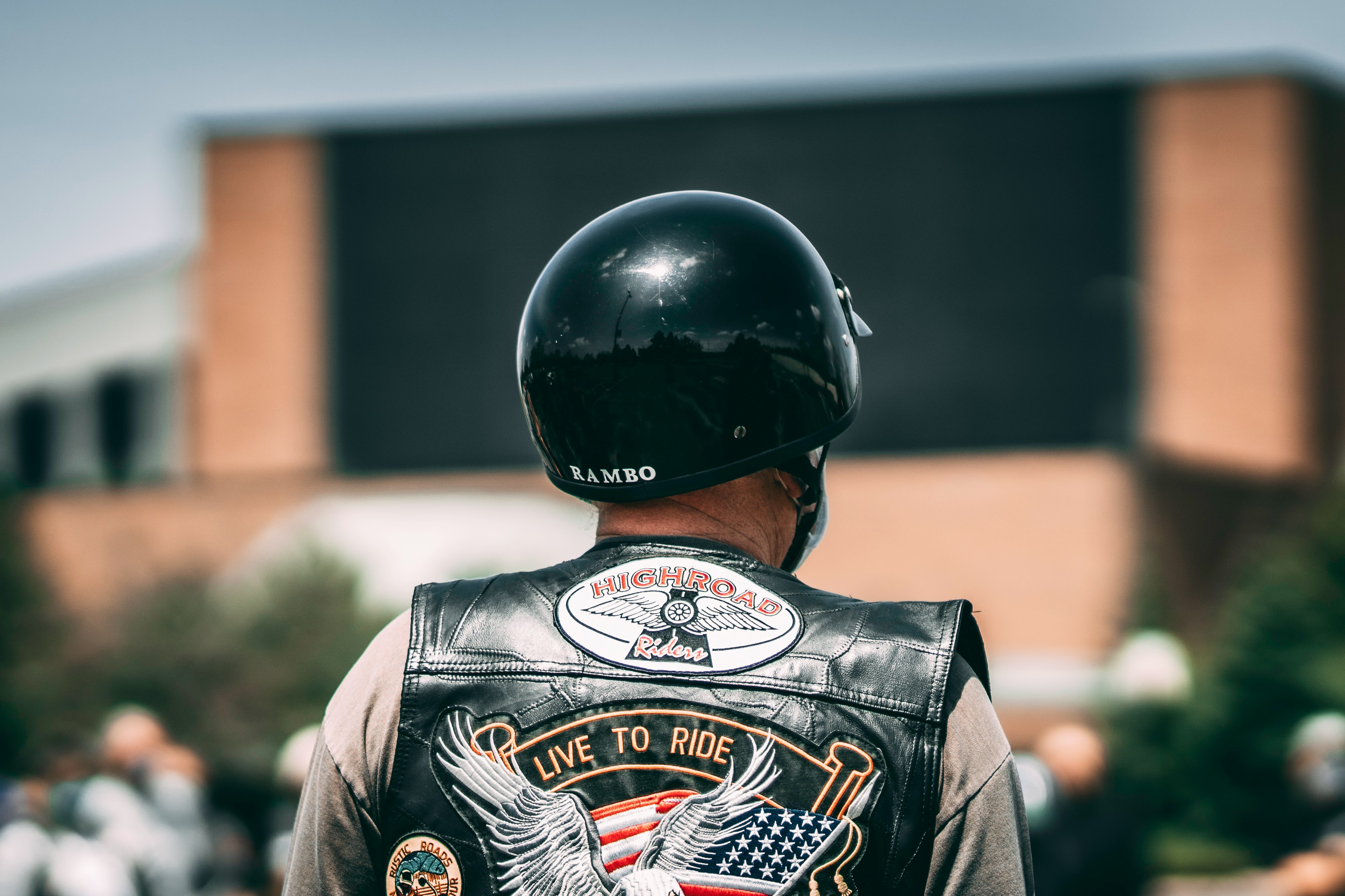 man in black helmet and black and white jacket