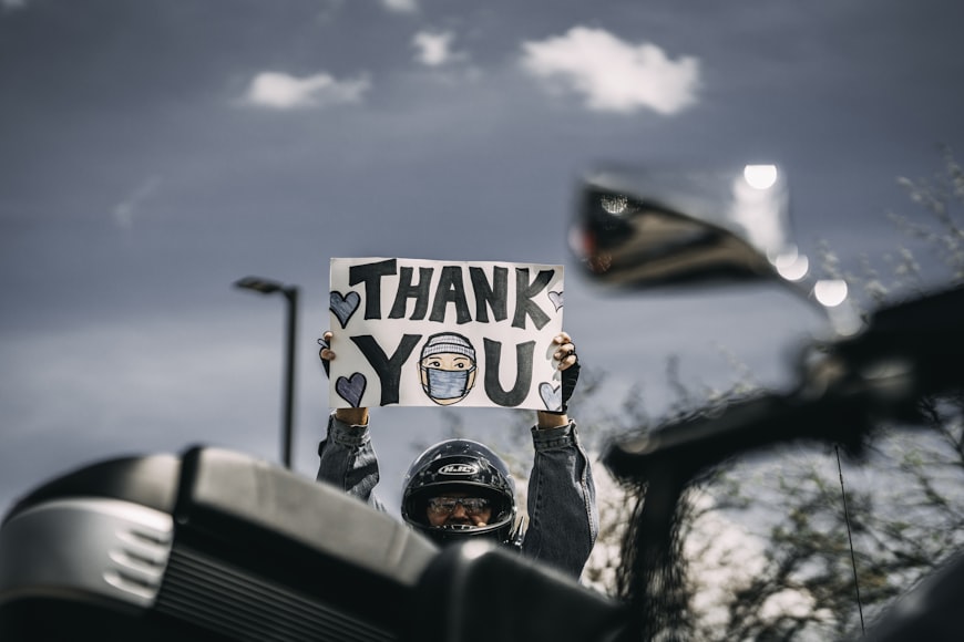 man showing thank you message