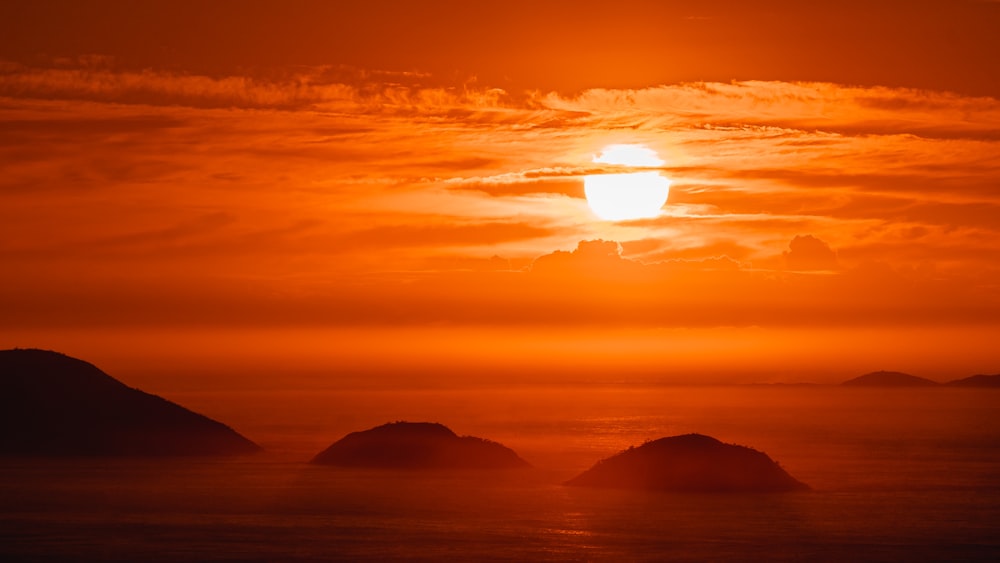 silhouette of mountains during sunset