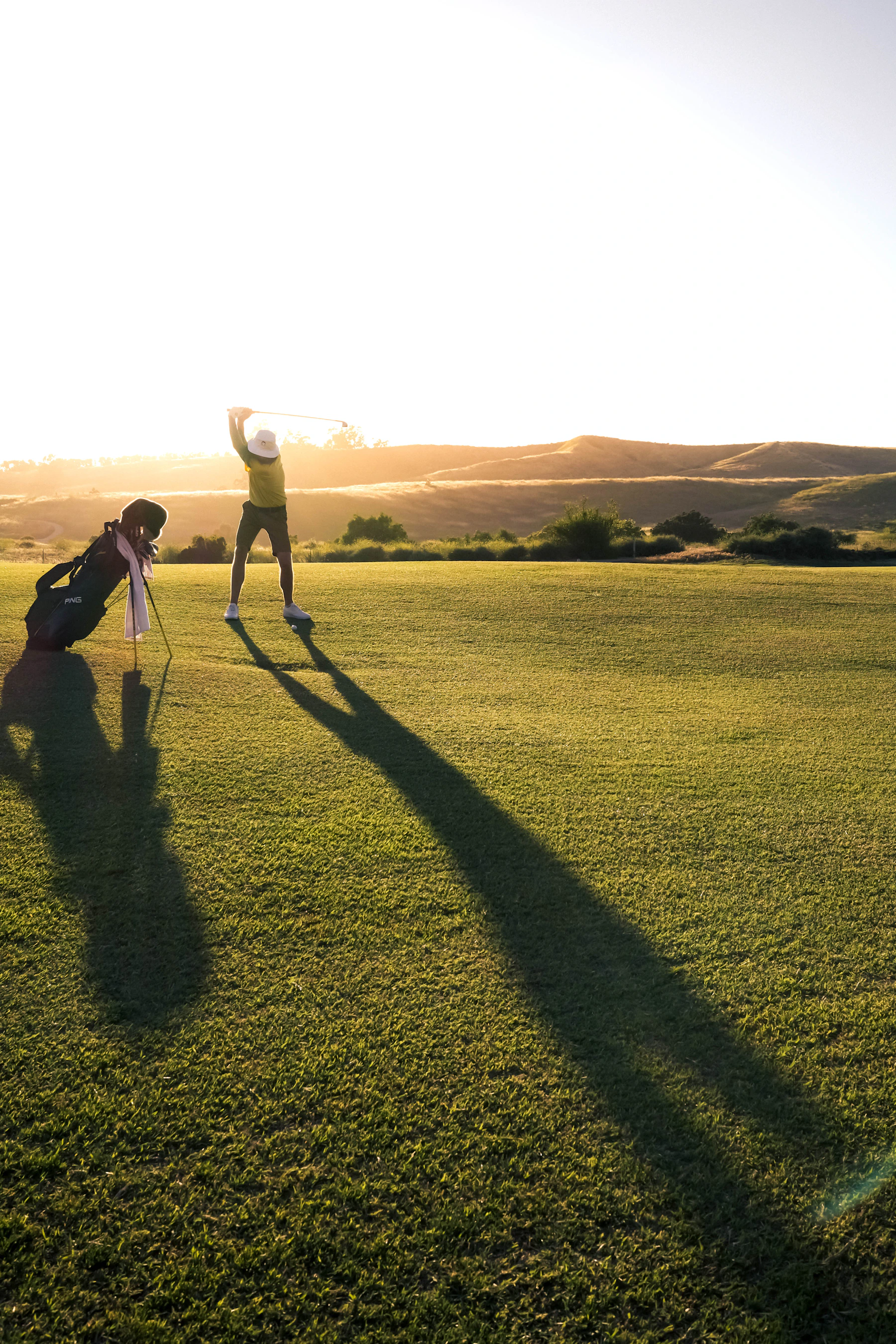 Two golfers walking the fairway