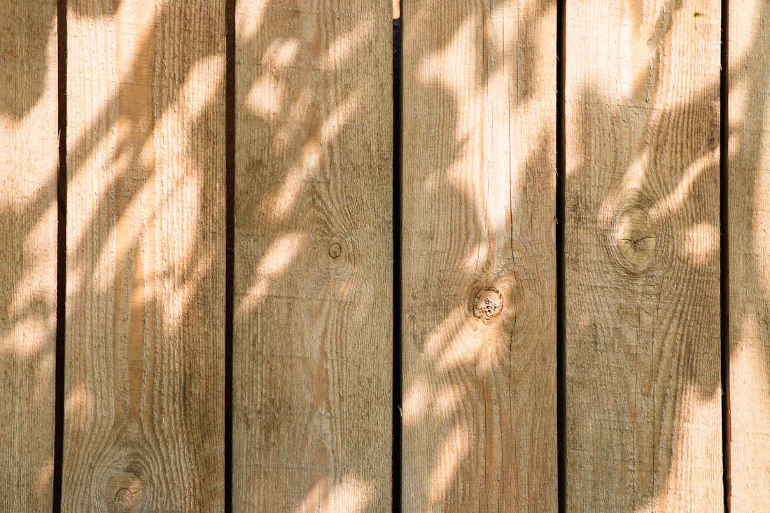 Wooden gate with metal latch hardware