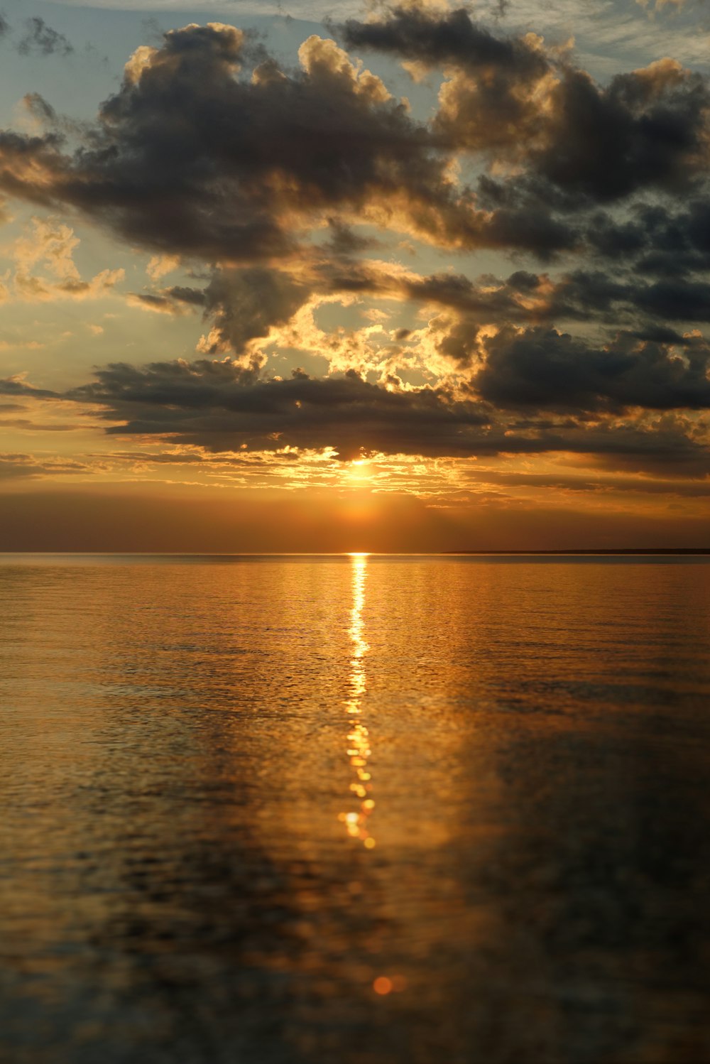 body of water during sunset