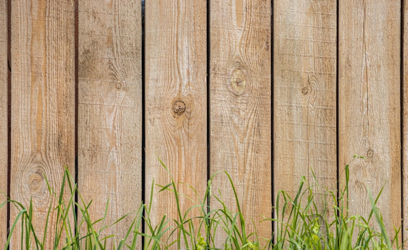 Wooden privacy fence installation