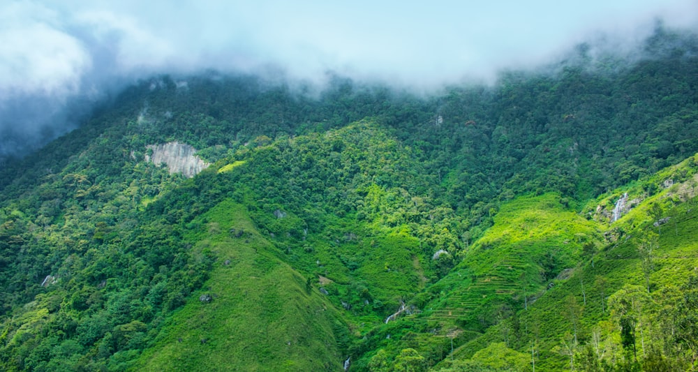 green mountains under white clouds during daytime