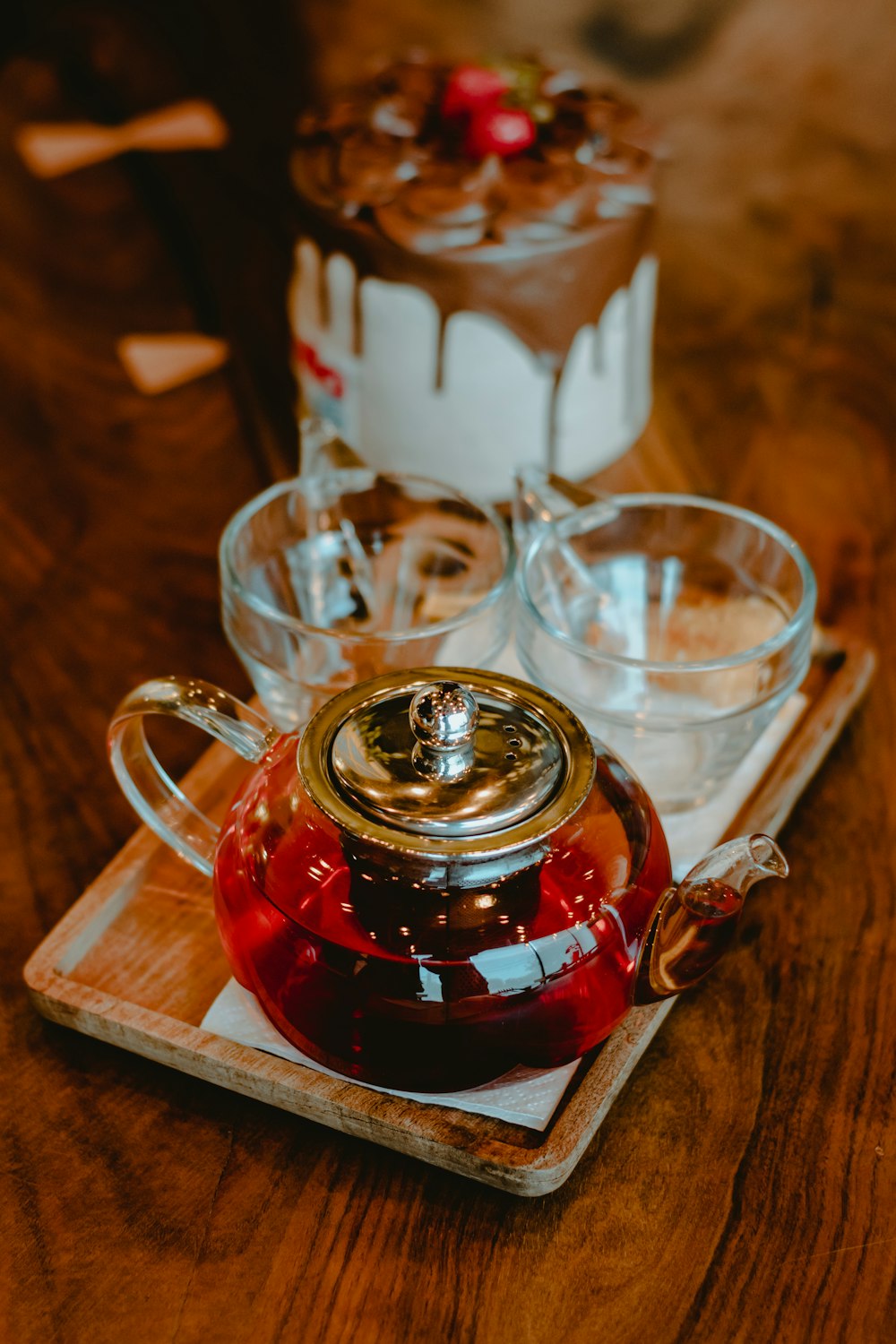 clear glass mug on brown wooden tray