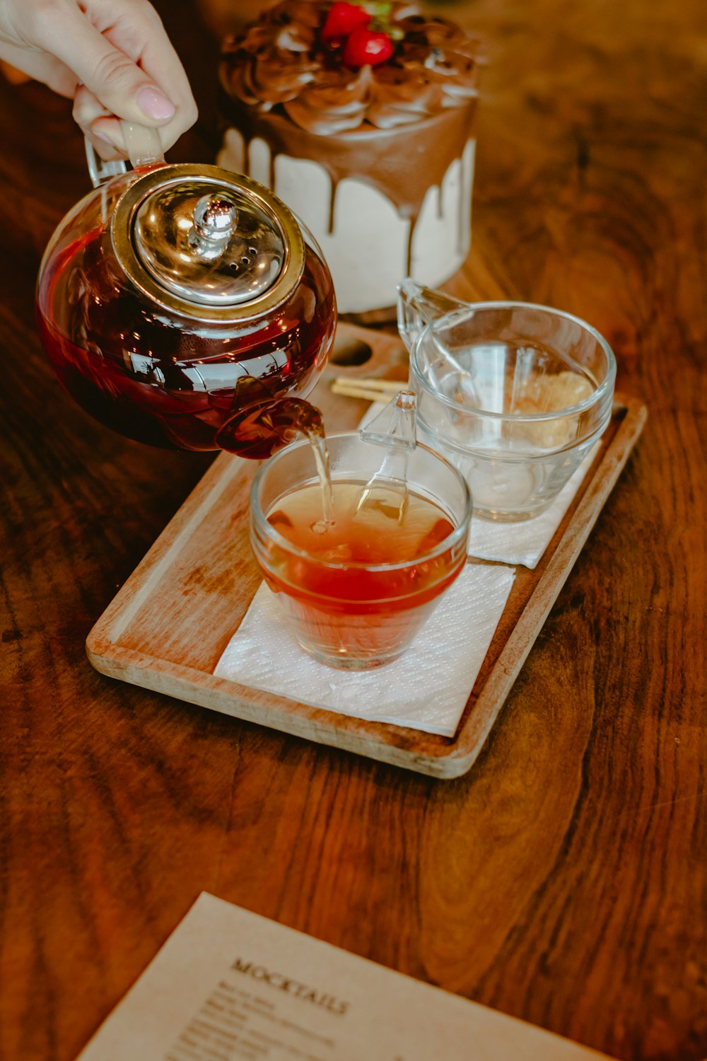 clear glass cup on brown wooden tray