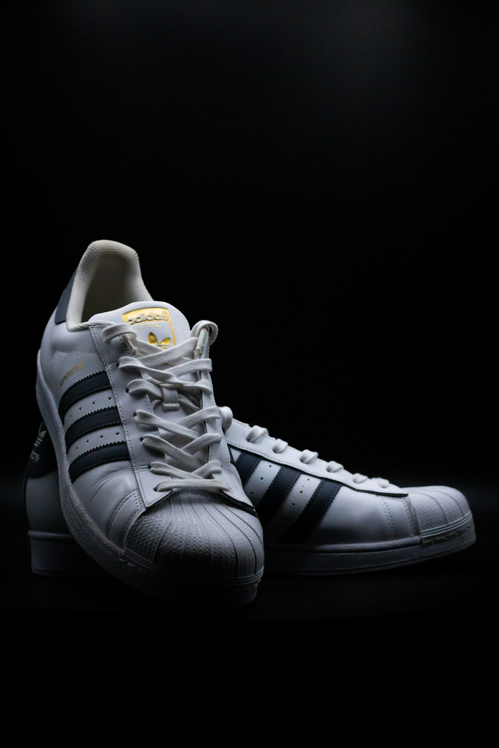 black and white adidas sneakers
