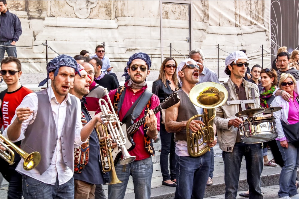 group of people holding musical instruments