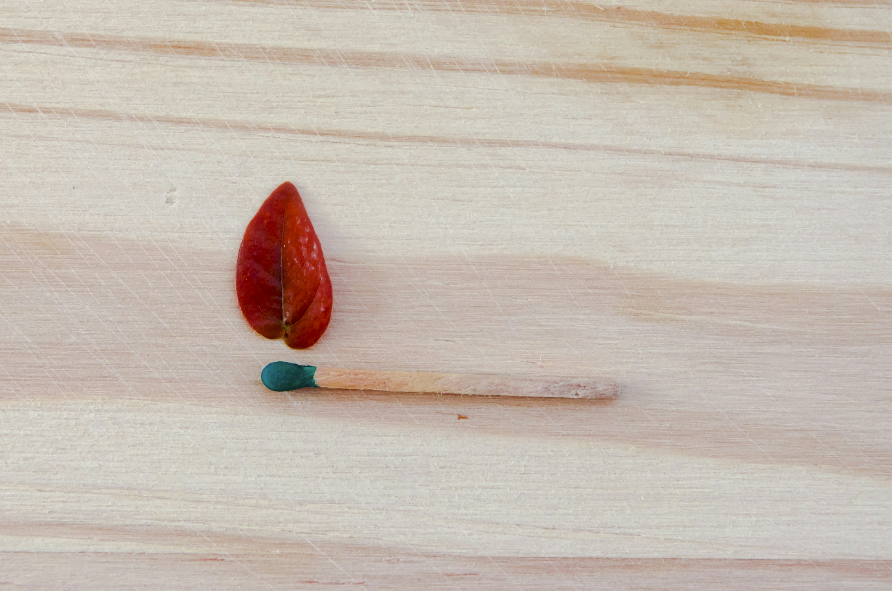 red heart shaped ornament on white textile