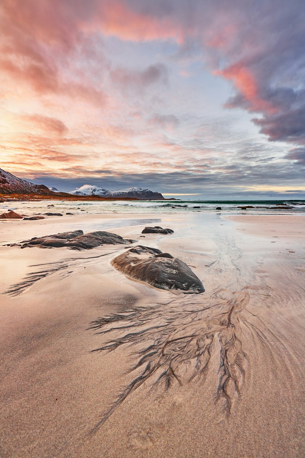 brown rock on brown sand during sunset