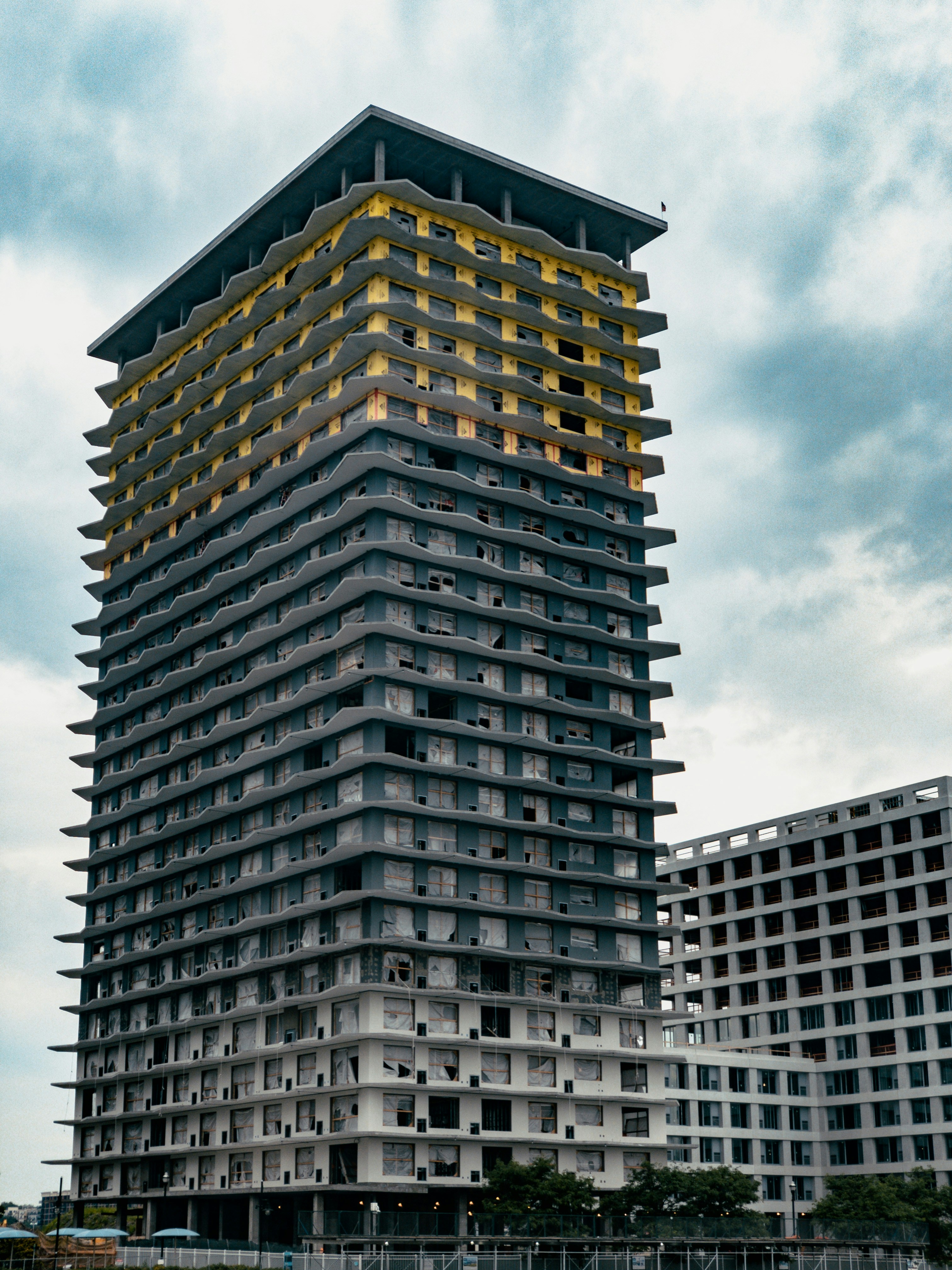 brown and black concrete building under blue sky during daytime