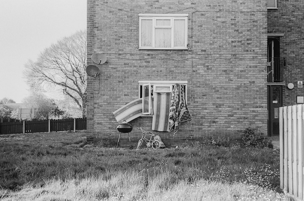 grayscale photo of brick building