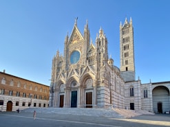 people walking near brown concrete building during daytime