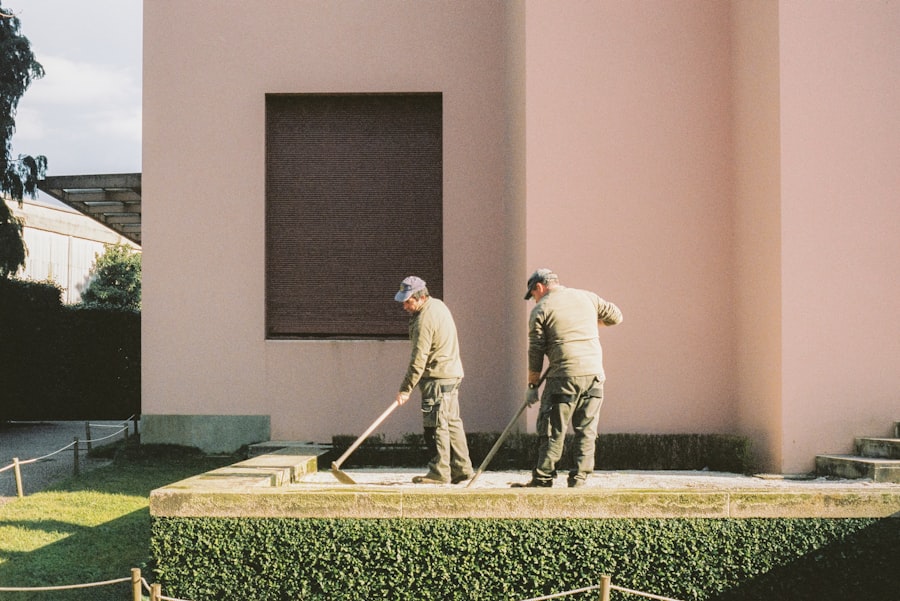 Landscaping crew maintaining a property entrance