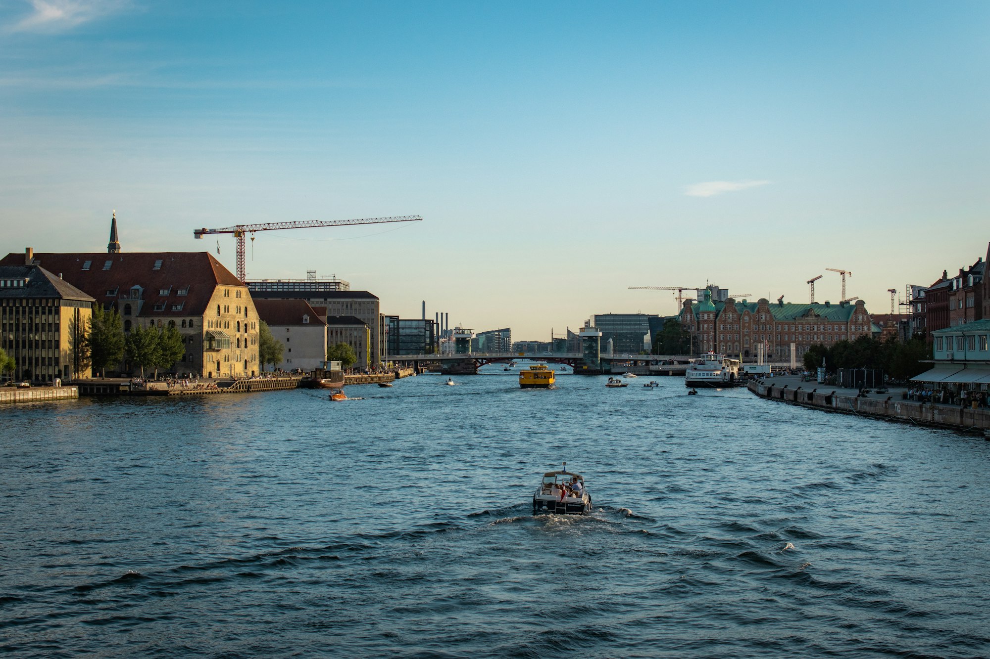 boat on water near buildings during daytime