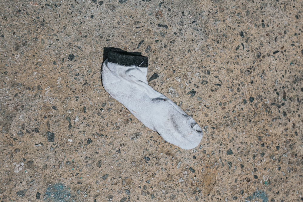 white sock on brown and black marble surface