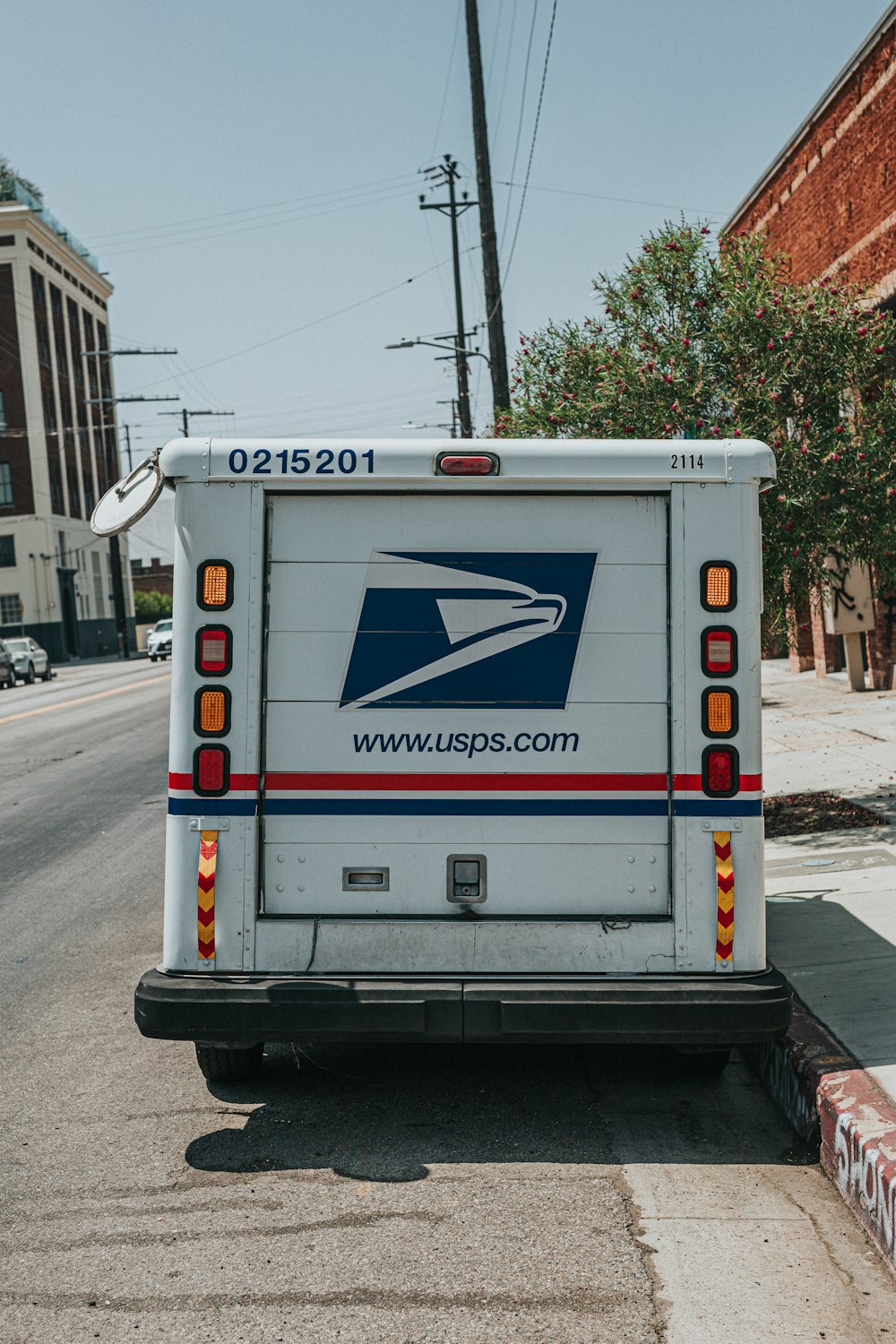 a mail truck parked on the side of the road