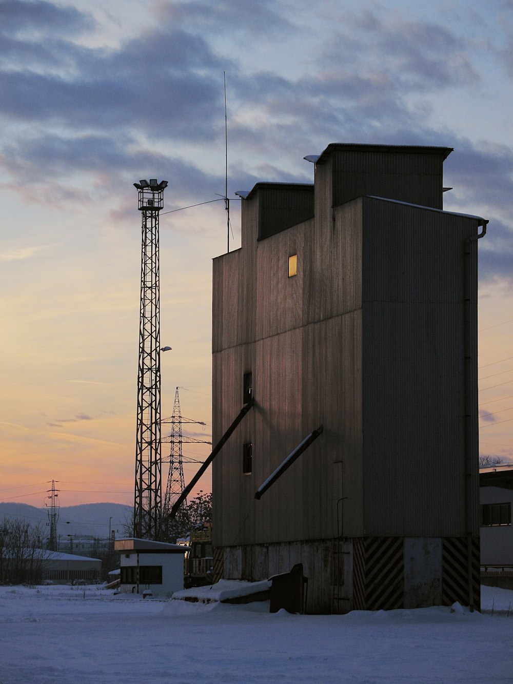 brown steel building during sunset