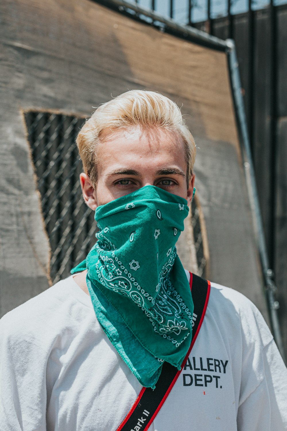 man in white shirt with green face paint