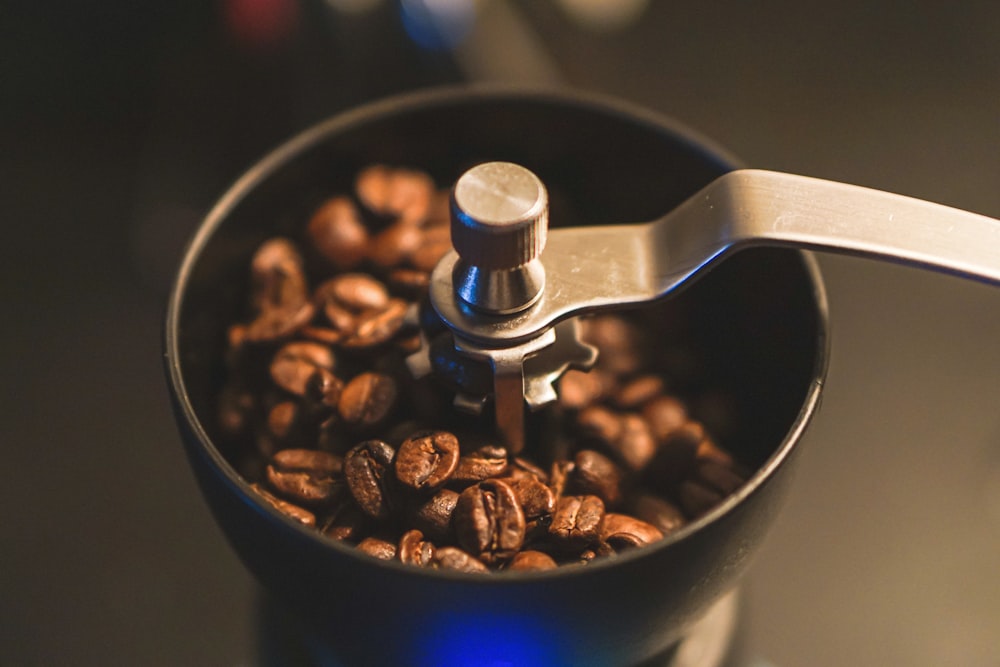 coffee beans in blue ceramic cup