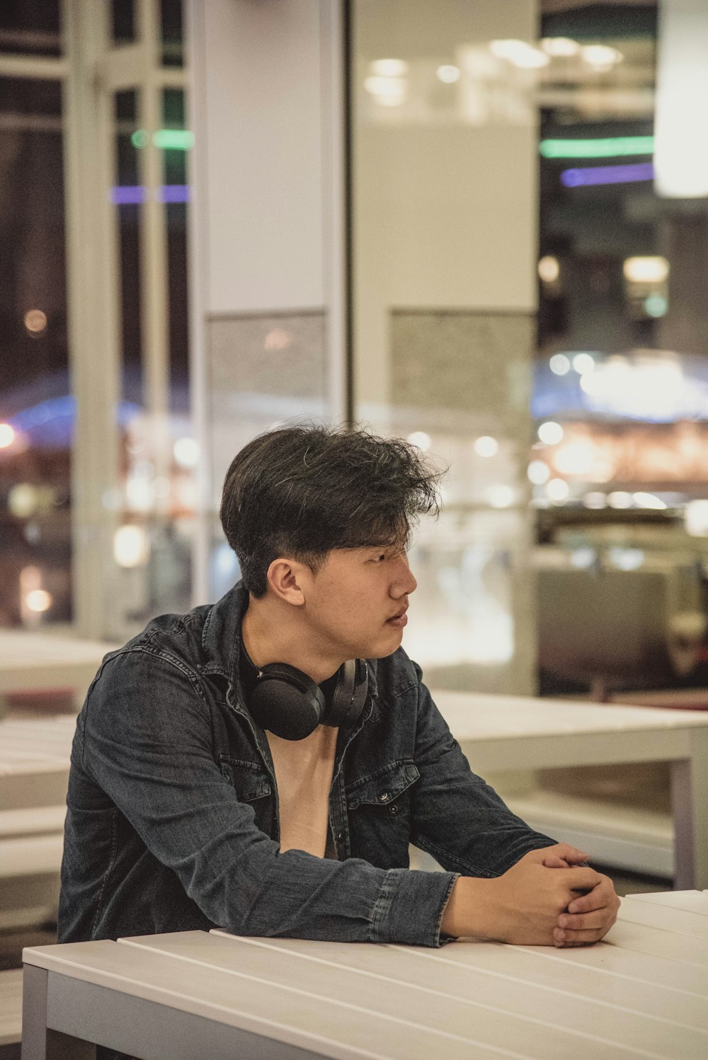 man in black jacket wearing black headphones