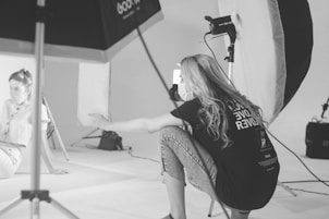 woman in black t-shirt sitting on chair