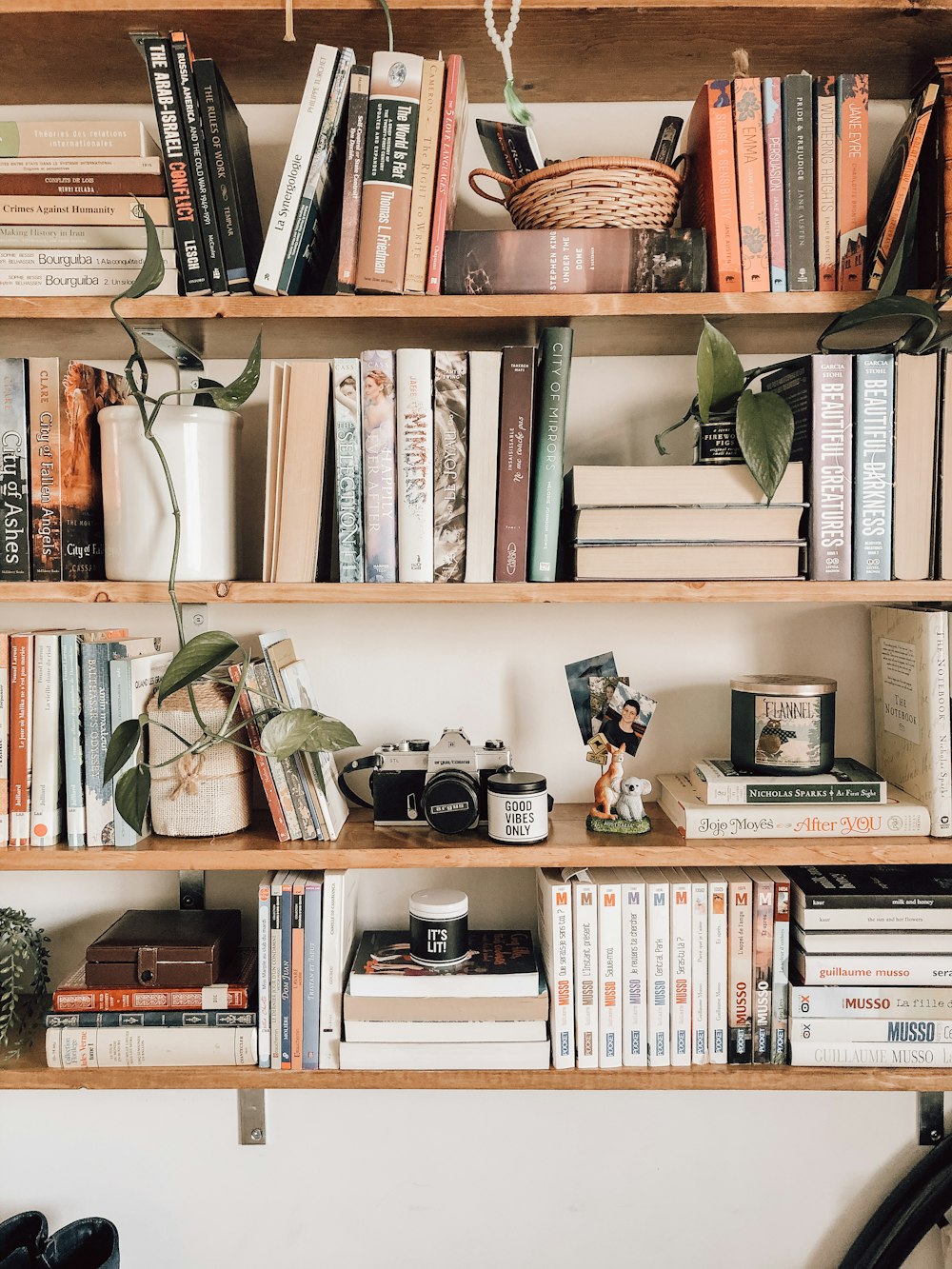 books on white wooden shelf