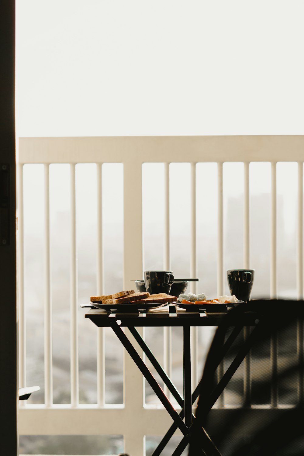 black ceramic mug on brown wooden table