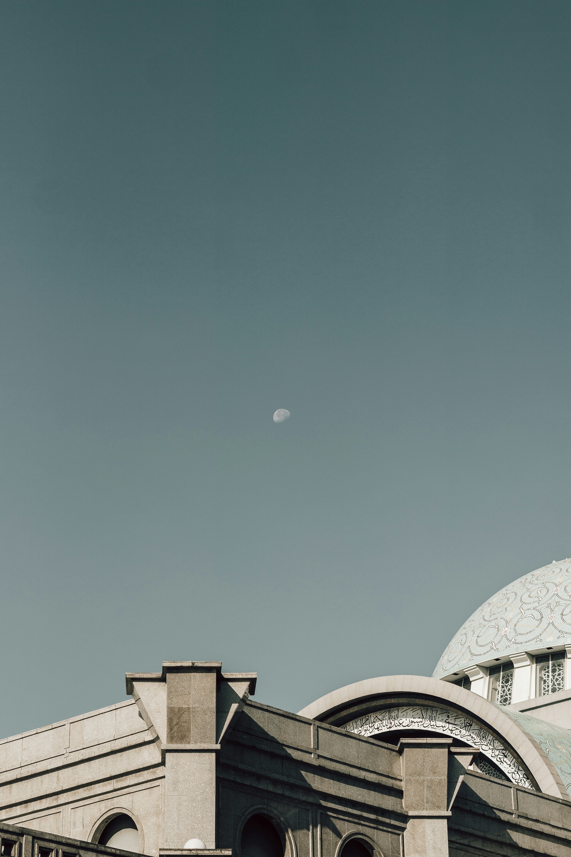 brown concrete building under moon
