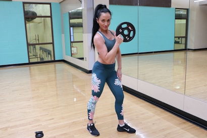 woman in blue leggings and white sports bra