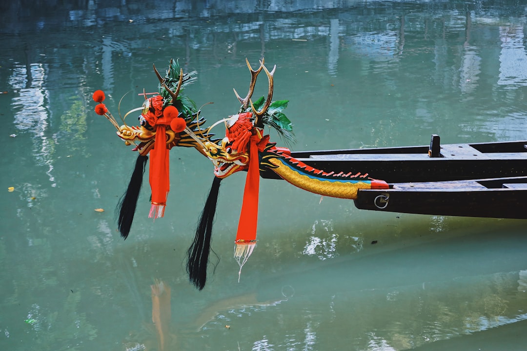 red and black boat on water