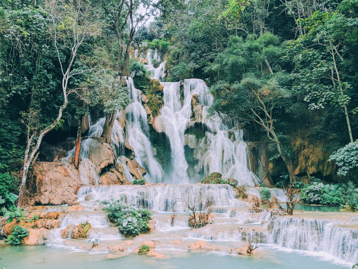 Kuang Si waterfalls cascading through dense tropical forest 30km south of Luang Prabang