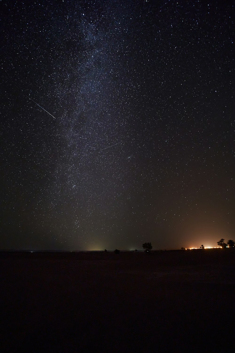 silhouette of people under starry night