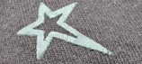 A close-up of a t-shirt featuring a starry night print.